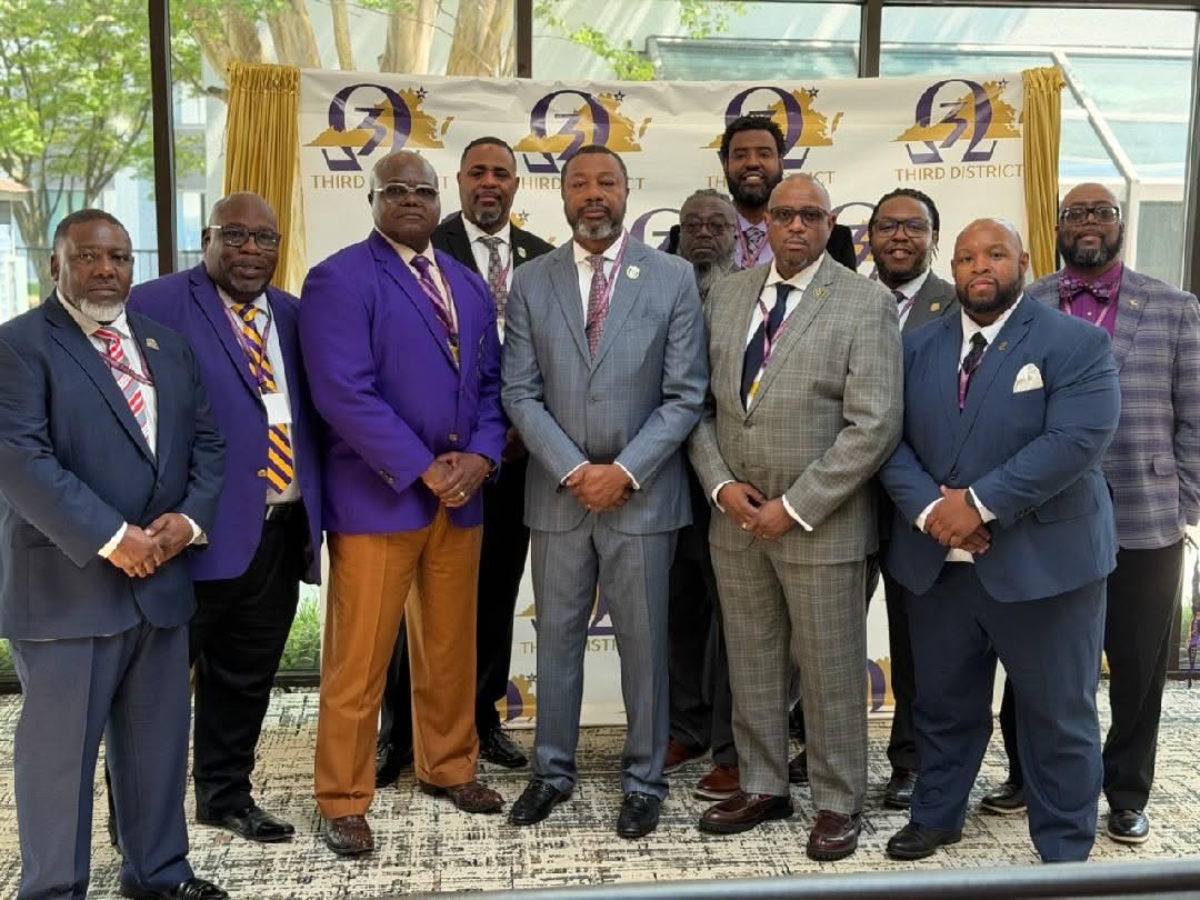 Alpha Iota brothers at the Third District meeting